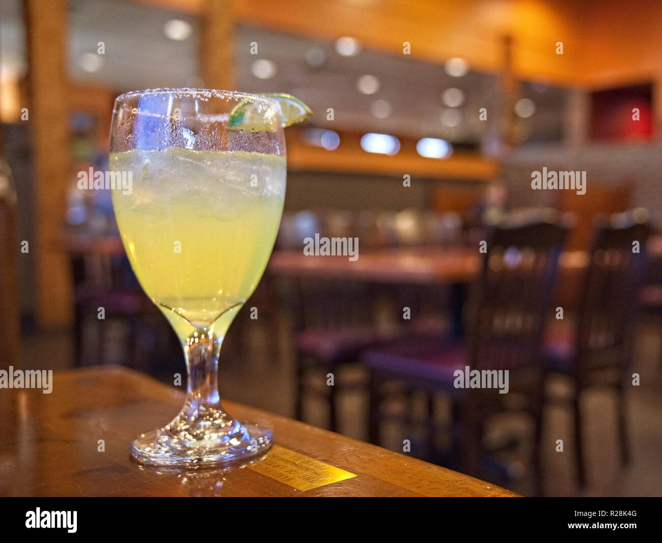Fresh Mexican Margarita cocktail drink on a restaurant or bar table. Stock Photo