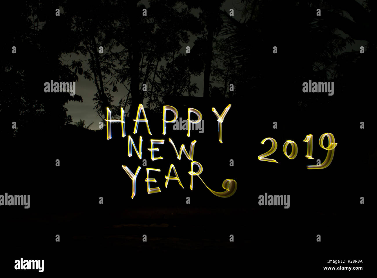 Luxury greetings happy New year 2019.  Hand writing with Light painting art work Stock Photo