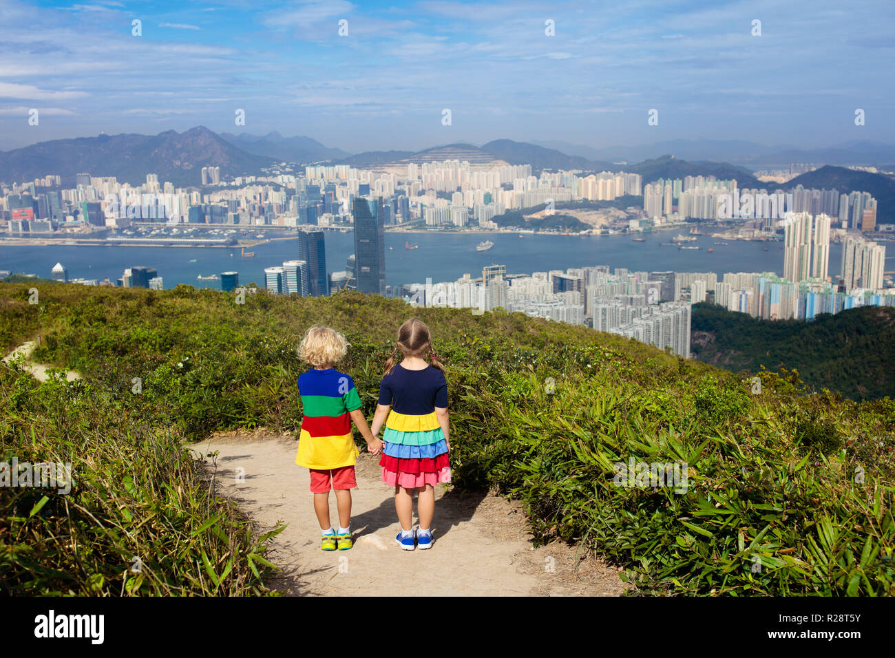 Family with kids hiking in Hong Kong mountains. Beautiful landscape