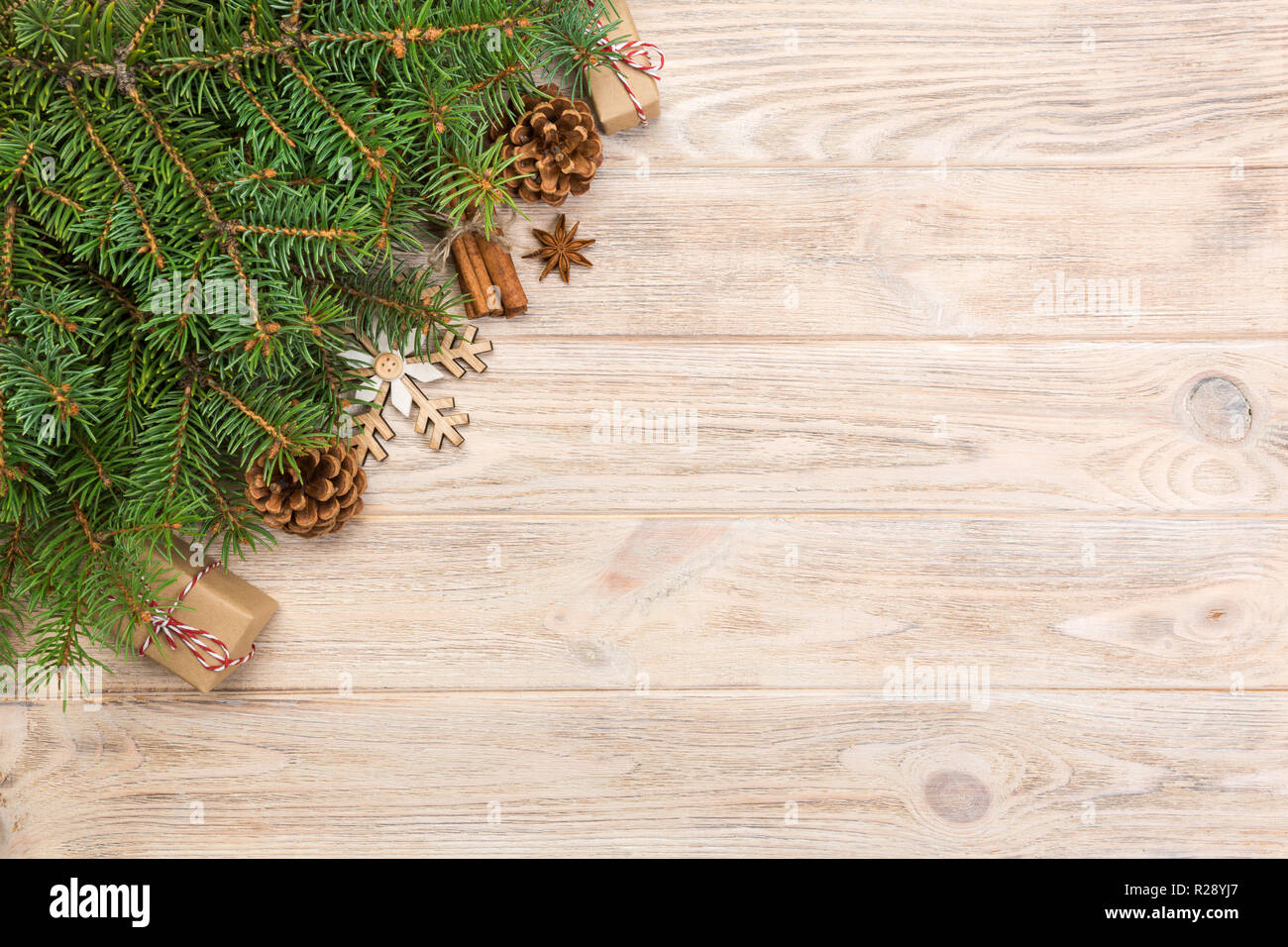 Christmas background with fir tree and gift box on wooden table. Top ...