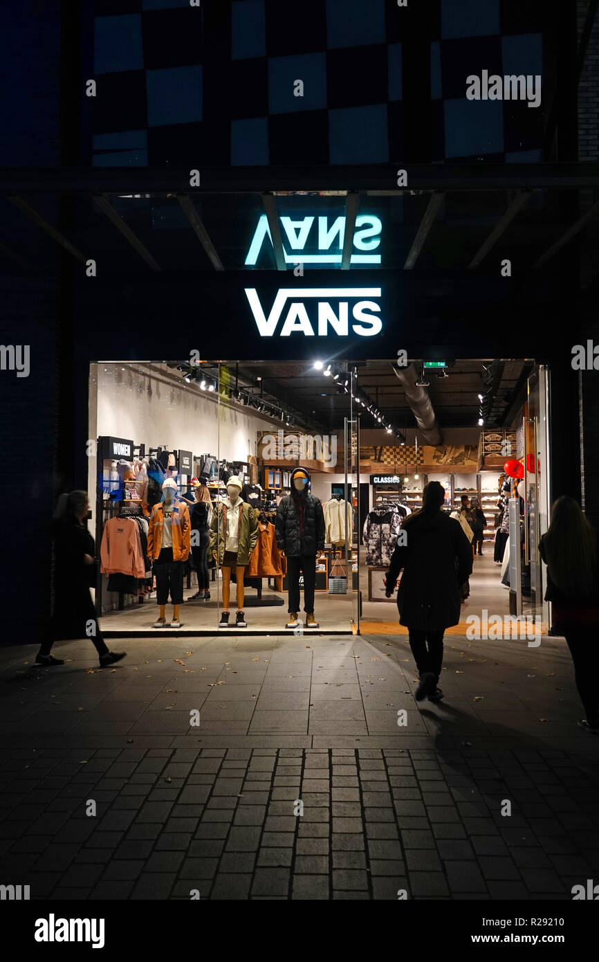 People in silhouette walking past a Vans store in Liverpool One shopping  complex at night. Liverpool UK. November 2018 Stock Photo - Alamy