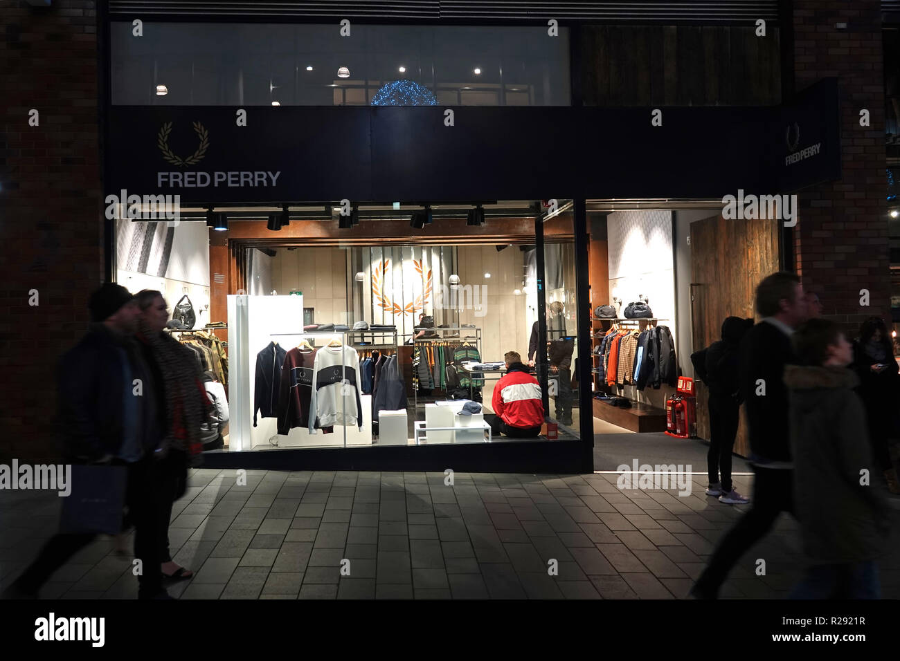 People in silhouette walking past a Fred Perry store in Liverpool One  shopping complex at night. Liverpool UK. November 2018 Stock Photo - Alamy