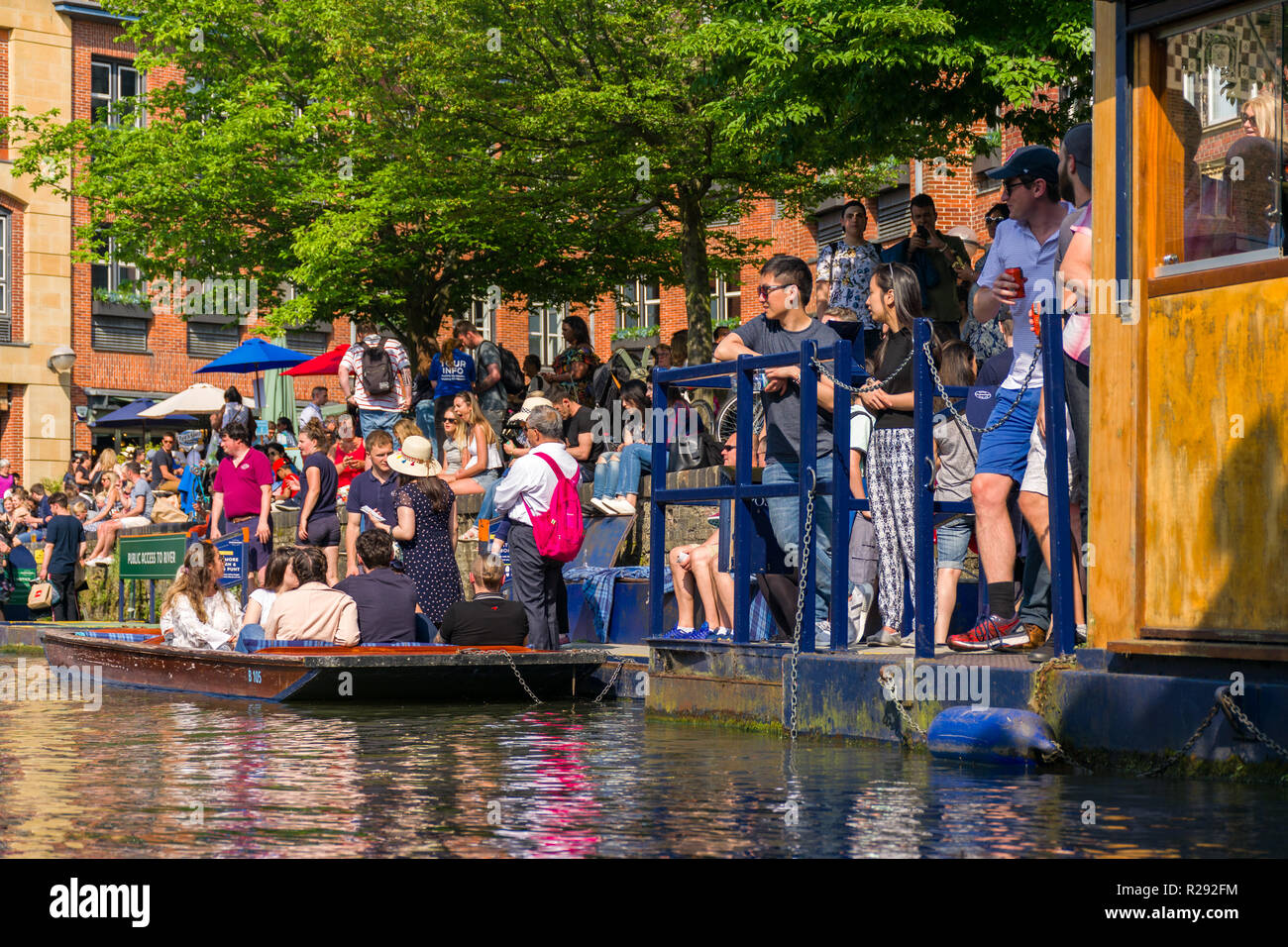 Tourists waiting for punt boat rides on a sunny Summer afternoon, Cambridge, UK Stock Photo