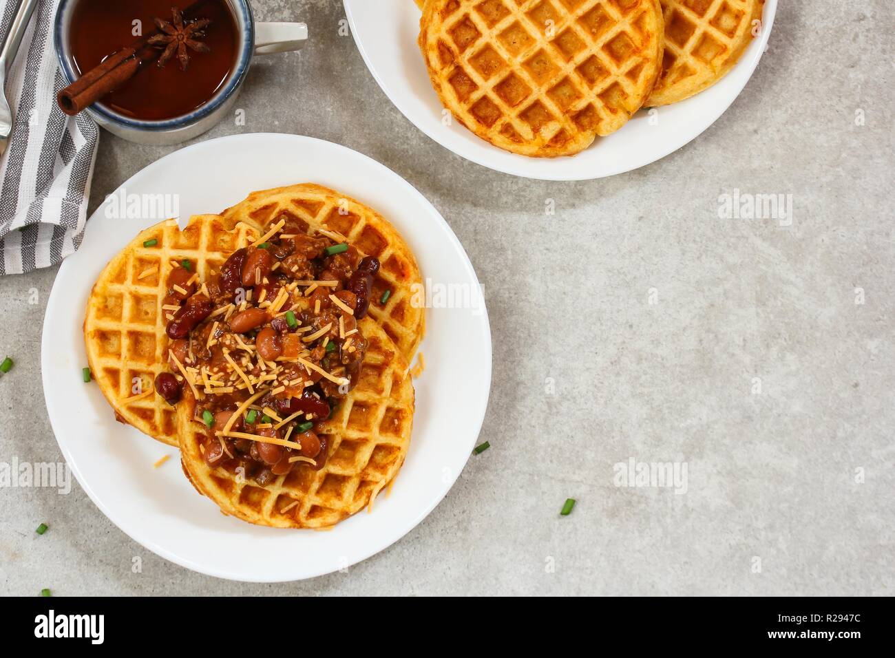 Homemade Cornbread Waffles served with Chili / Thanksgiving breakfast Stock Photo