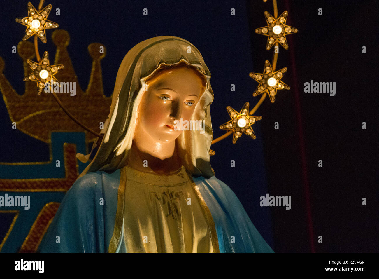 Notre Dame de Lourdes (Our Lady of Lourdes) - a statue of Virgin Mary in the church of San Vittore Martire. Stock Photo