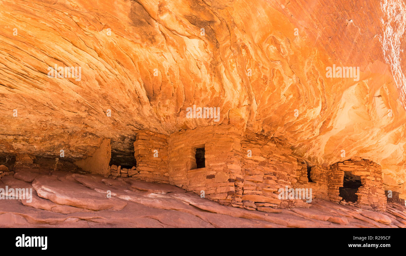 Puebloan ruins under  a cliff in Mule Canyon in the Cedar Mesa Plateau in Bears Ears National Monument in Utah look like the ancient stone granaries a Stock Photo