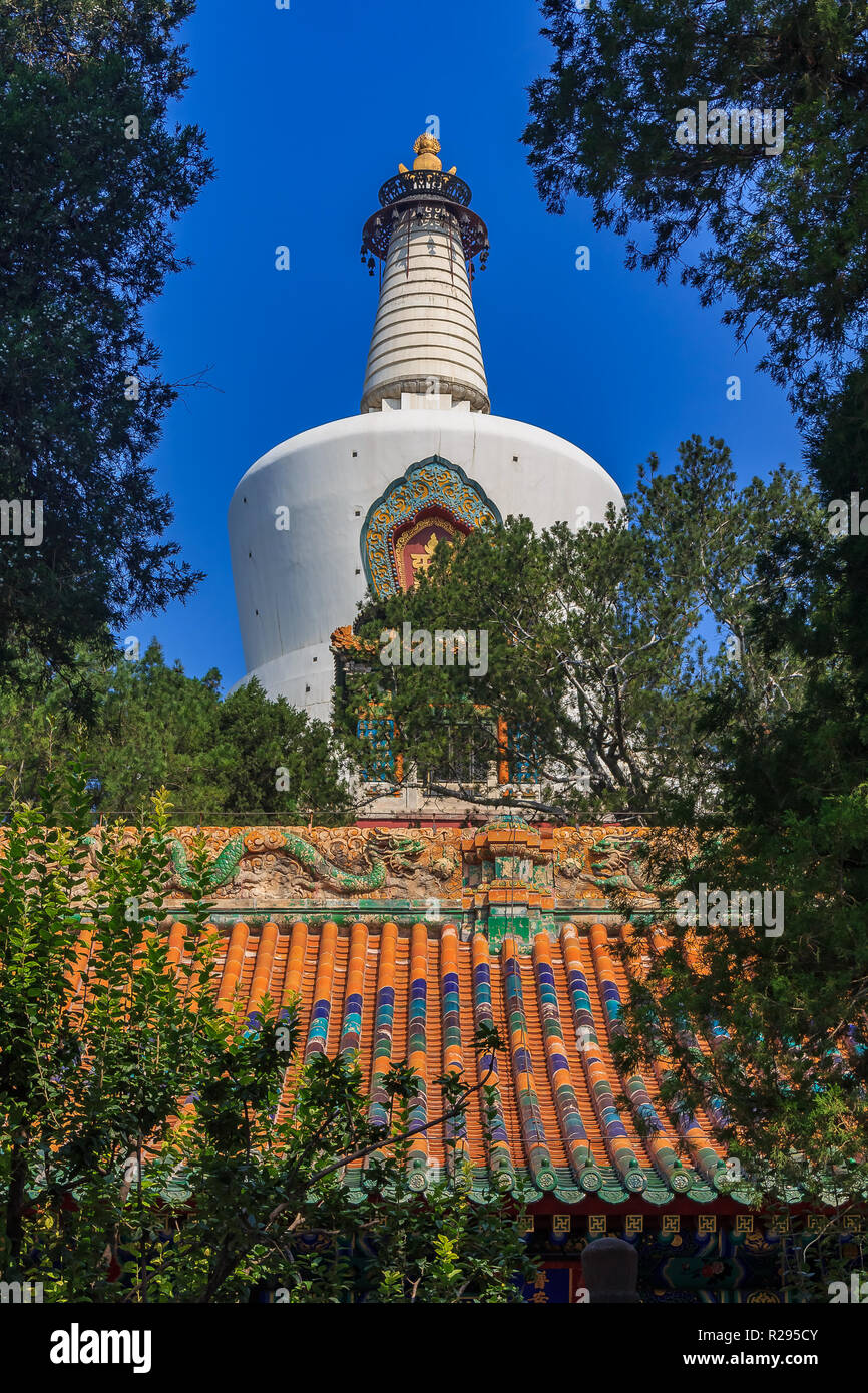 The Jade Island with Bai Ta (White Pagoda or Dagoba) stupa in Buddhist Yong An Temple of Everlasting Peace in Beihai Lake Park  in Beijing, China Stock Photo