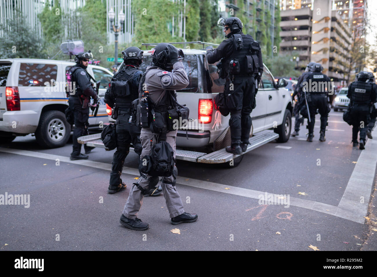 Portland, OR / USA - November 17 2018: Rapid response team police officers unit along with a medic at downtown demonstration that turned into civil di Stock Photo
