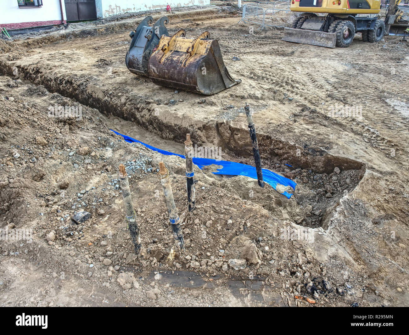 Installing new water pipes in old town street, maintenance work, dig
