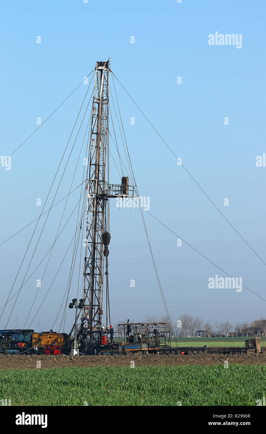 oil drilling rig and workers Stock Photo