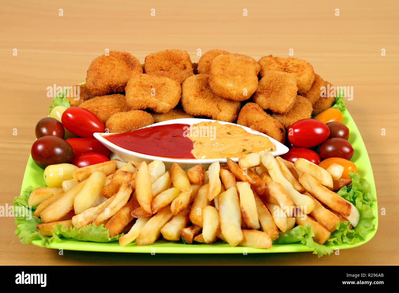 chicken nuggets and french fries on plate fast food Stock Photo