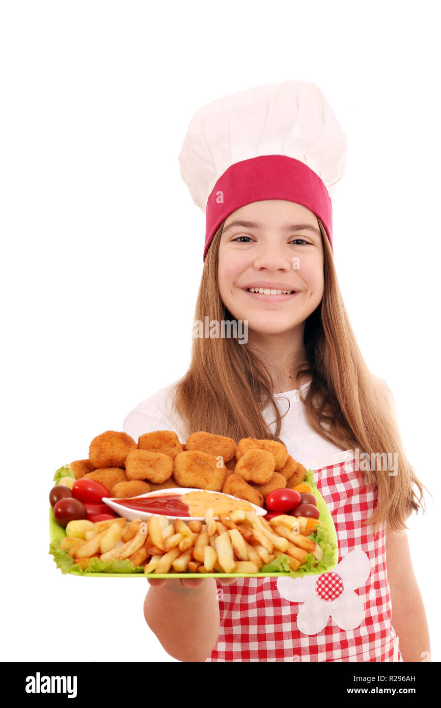 Happy girl cook with chicken nuggets and french fries on plate Stock Photo