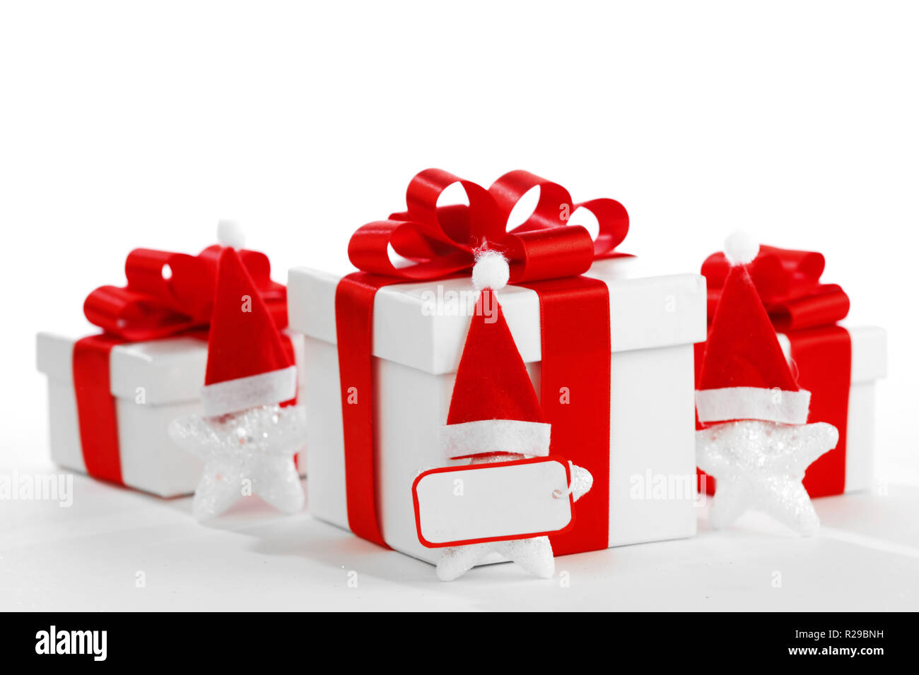 Gift boxes with santa claus stars isolated on white background Stock ...