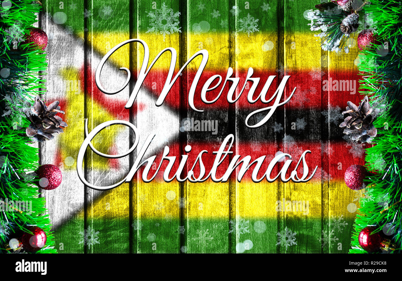 Merry christmas holiday concept with blurred flag image of Zimbabwe
