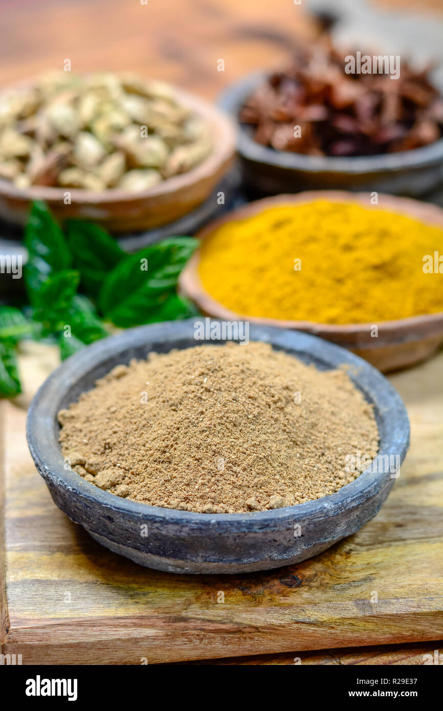 Amchoor or aamchur, mango powder, fruity spice powder made from dried unripe green mangoes in India, used to flavor foods close-up Stock Photo
