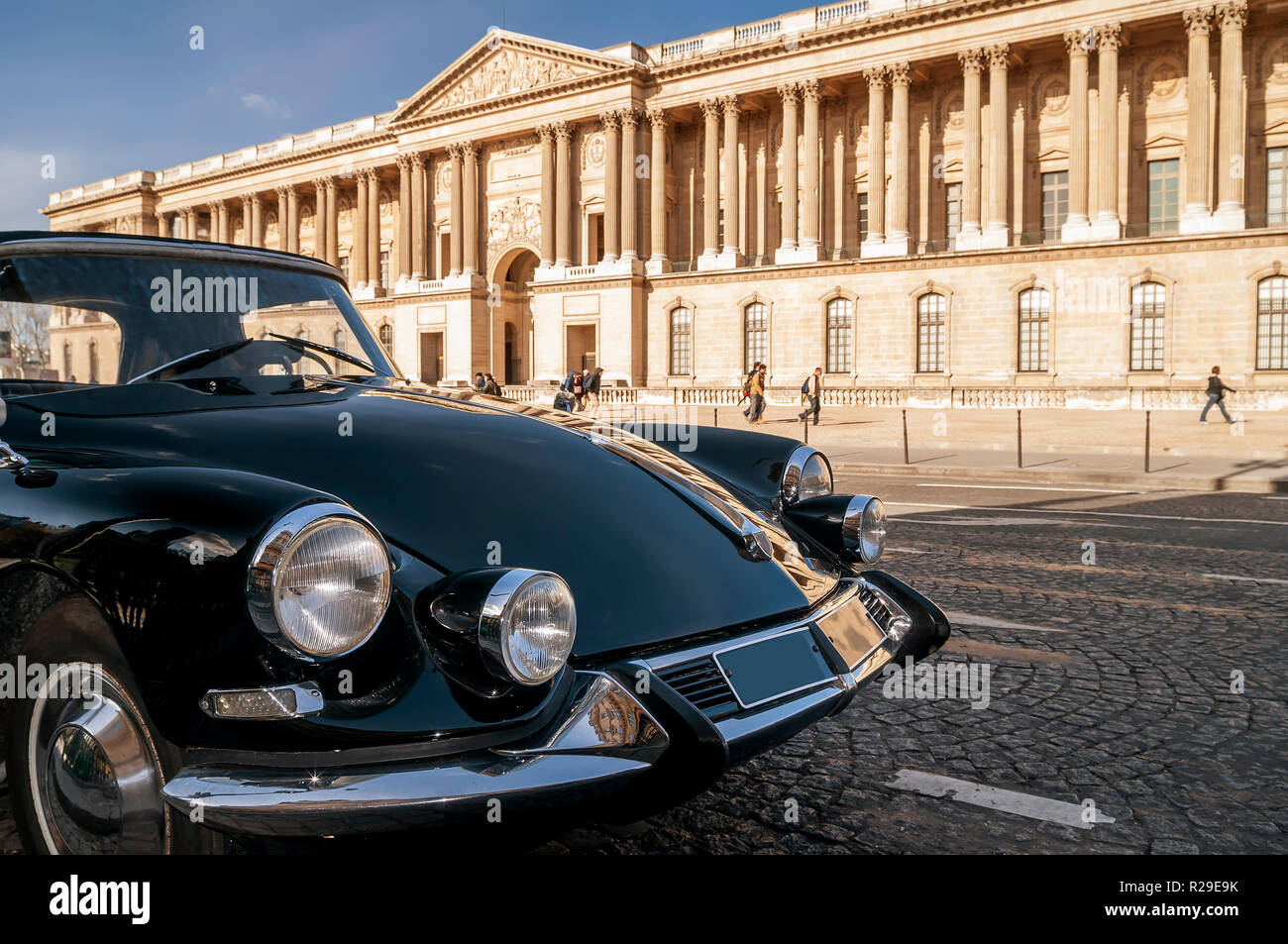 Beautiful black vintage car parked in front of the Louvre Museum, Paris, France Stock Photo