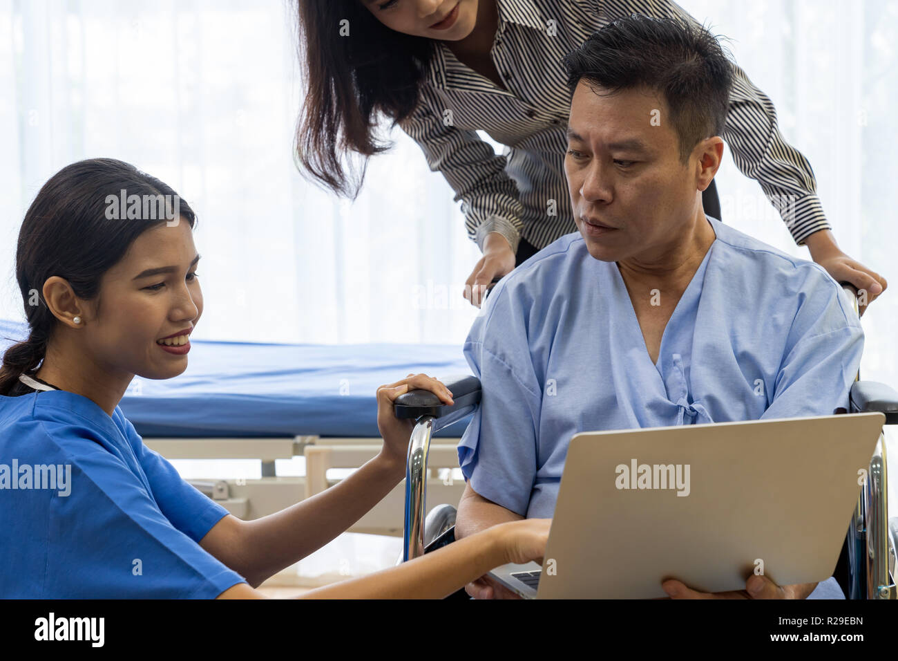 Physical therapist explain treatment method to senior patient and
