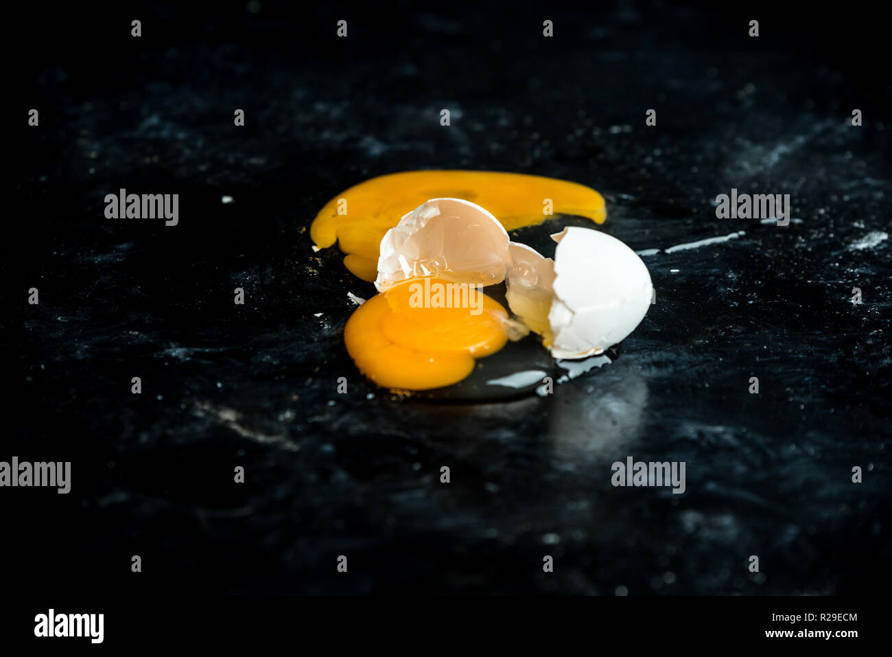 broken egg on a table Stock Photo