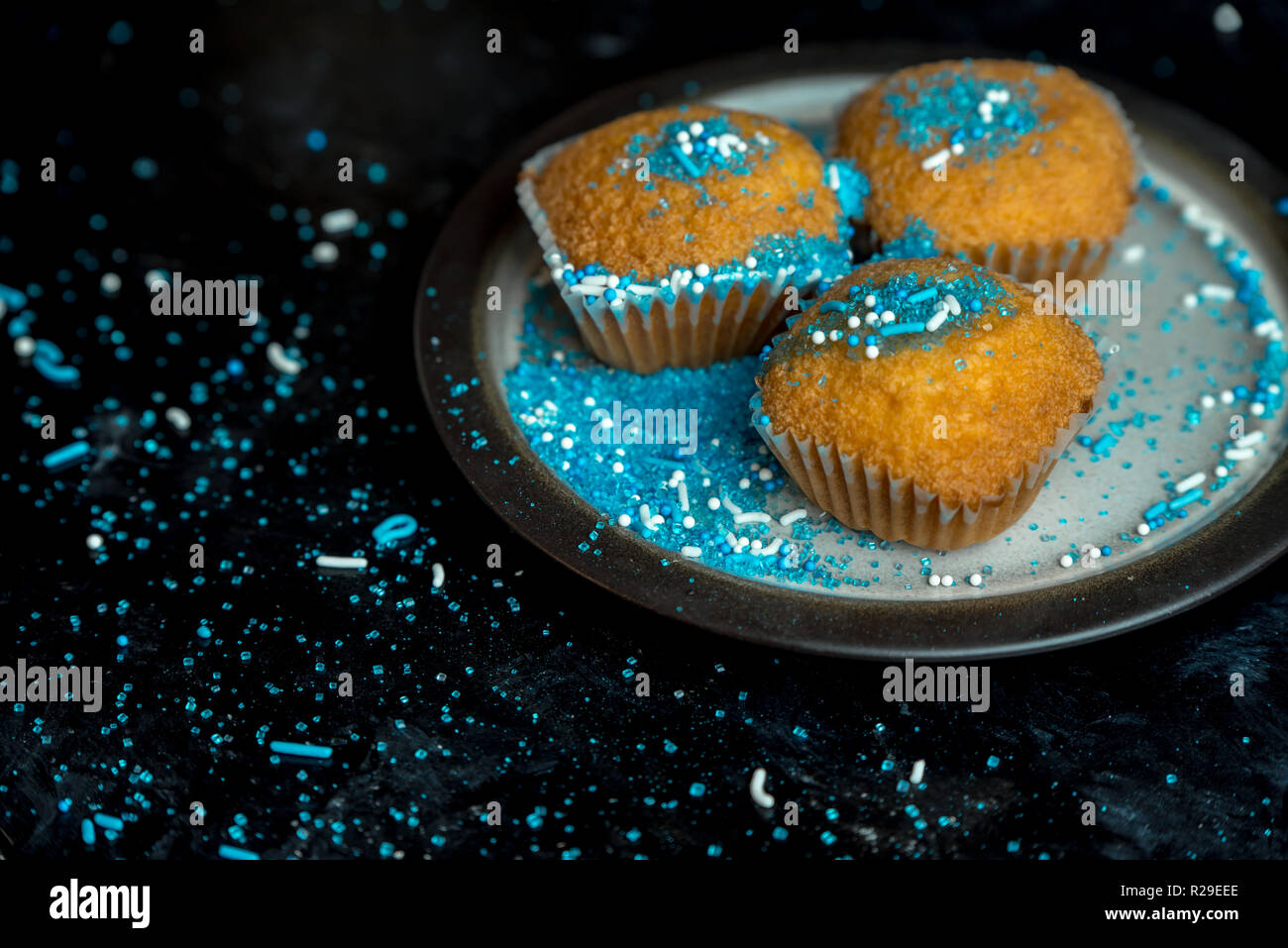 lemon muffins sprinkled with blue and white sprinkles Stock Photo Alamy