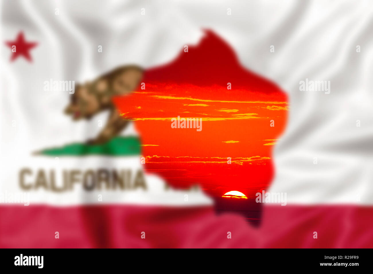 Blurred california Republic Flag with red sunset sky background. concept of fire affecting California in 2018. The most devastating and deadly ever seen in the United States of America. Stock Photo