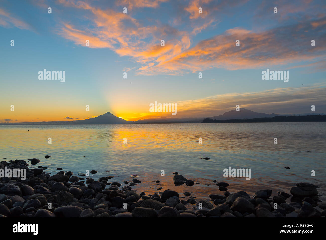 Landscape at sunrise on Lake Llanquihue with Osorno volcano and Calbuco in the background, southern Chile Stock Photo