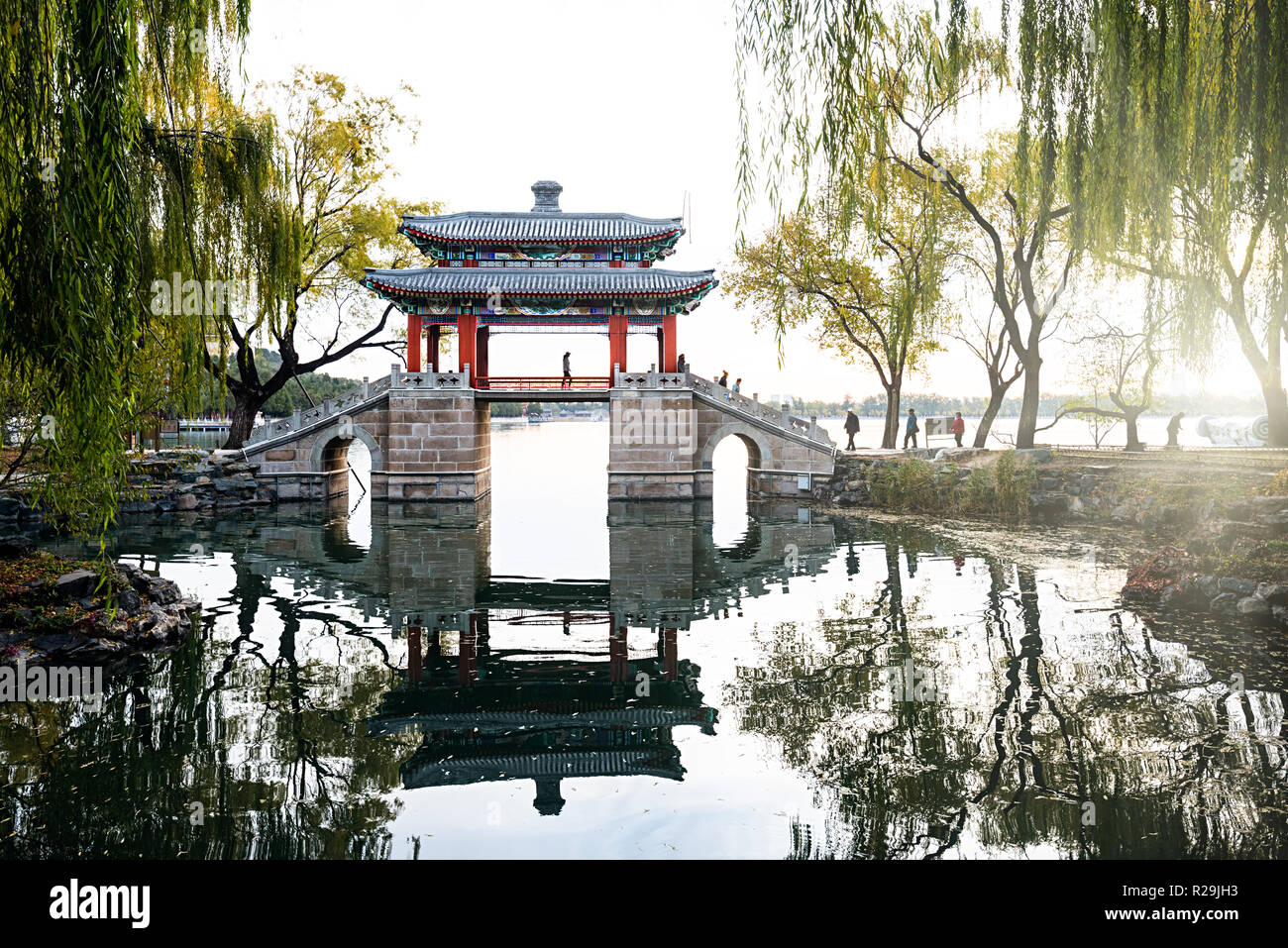 A tourist go by the pavilion bridge in Xidi of Summer Palace in the morning Stock Photo