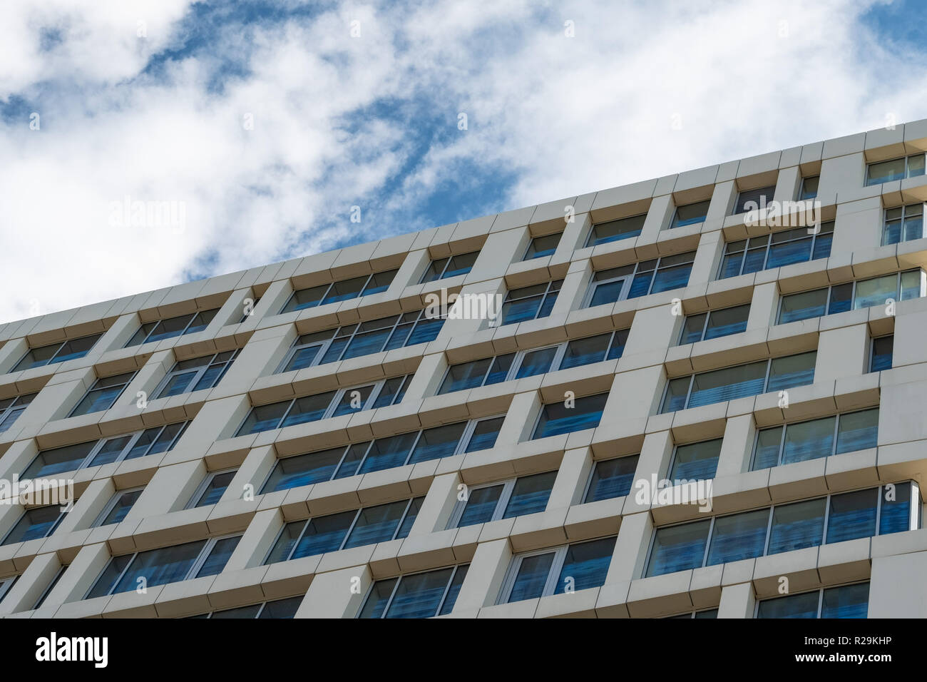 The facade of a multistory building against the blue sky Stock Photo ...