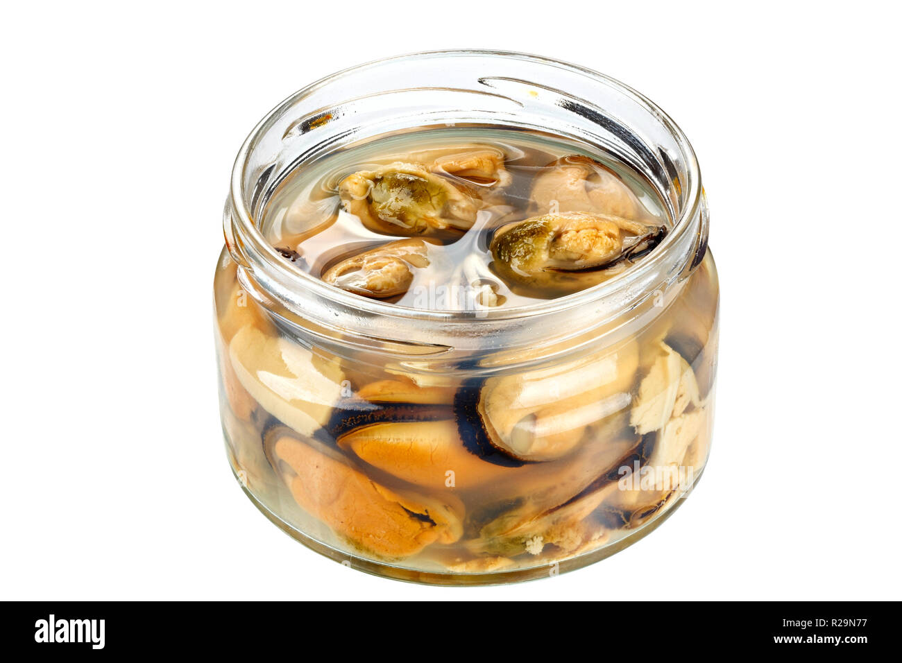 Marinated mussels isolated in a jar on a white background. clipping