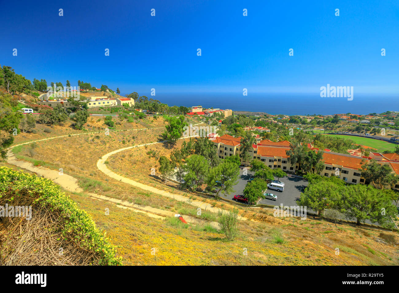 Scenic landscape of Pacific Coast in California. Panoramic aerial view of Pepperdine University, an American university in Malibu, Unites States. The campus on the hills overlooking the Pacific Ocean. Stock Photo