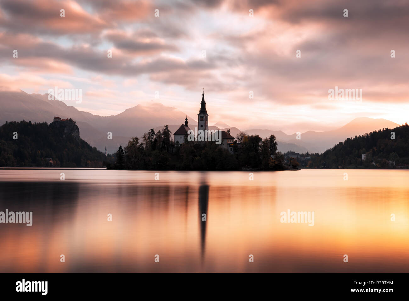 Colorful sunrise view of Bled lake in Julian Alps, Slovenia. Pilgrimage church of the Assumption of Maria on a foreground. Landscape photography Stock Photo