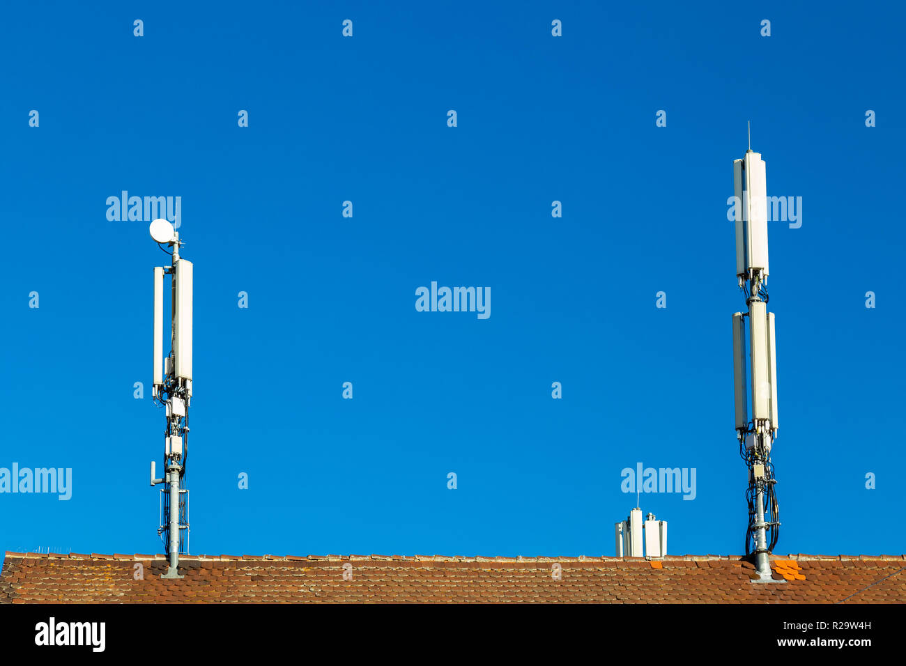 Cell tower on a rooftop in Germany Stock Photo