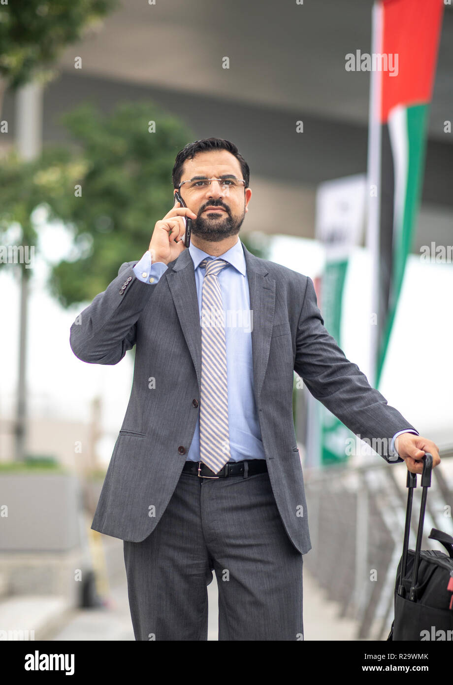 arab businessman  on a phone in Dubai Stock Photo