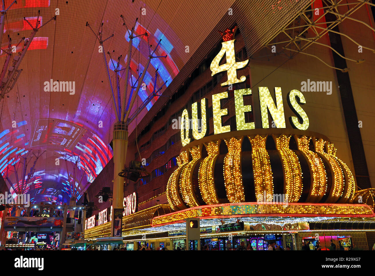 Neon lights of casinos including 4 Queens in Fremont Street at night, Las Vegas, Nevada, America Stock Photo