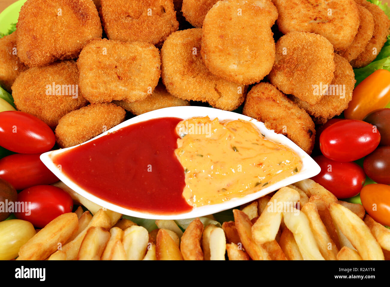 tasty chicken nuggets and french fries fast food Stock Photo