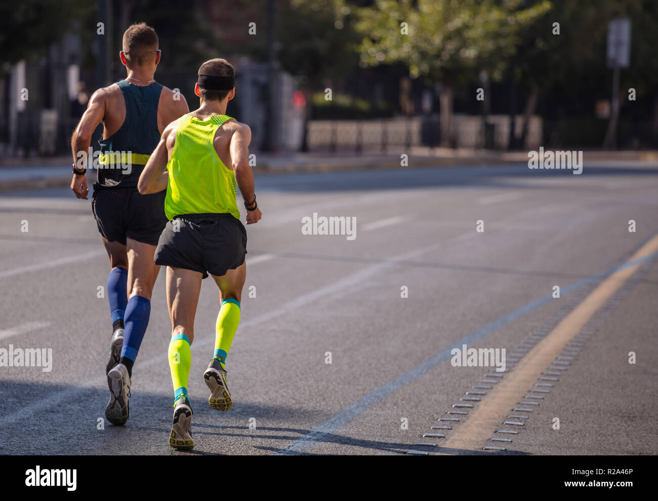 Marathon Running Race Two Men Runners On City Roads Back View Copy Space Stock Photo Alamy