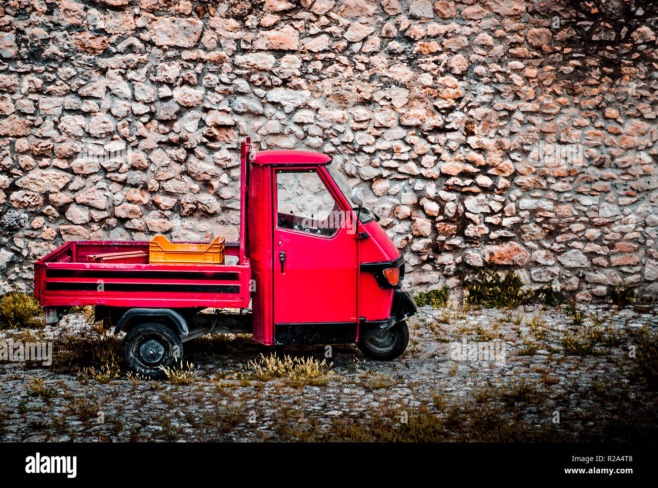 The Piaggio Ape sometimes referred to as Ape Piaggio, is a three-wheeled light commercial vehicle based on a vespa scooter produced since 1948 by Piag Stock Photo