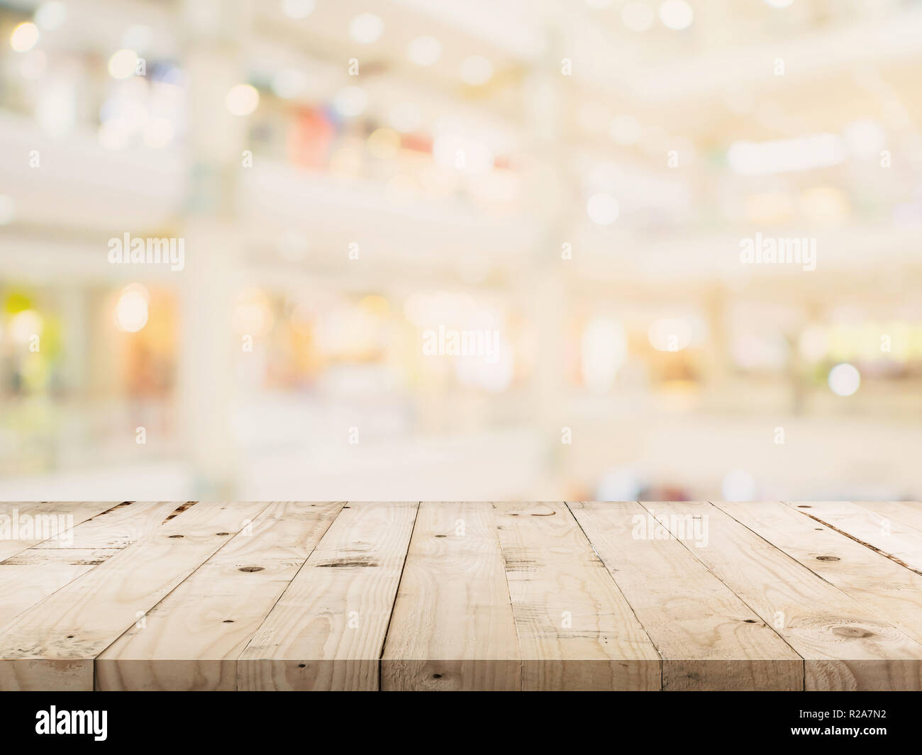 Empty wood table and Blurred background image. supermarket blur background with space display montage for product. Stock Photo