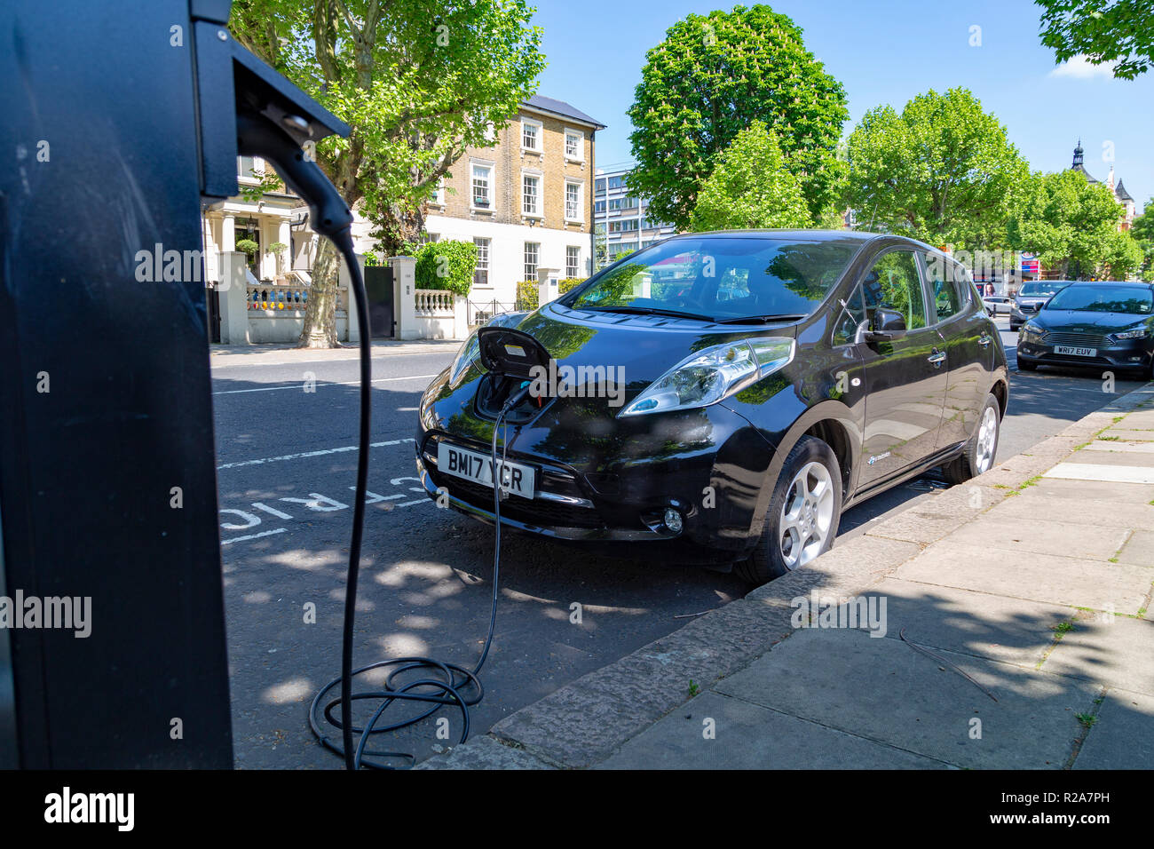 Electric cars charging in London, UK Stock Photo