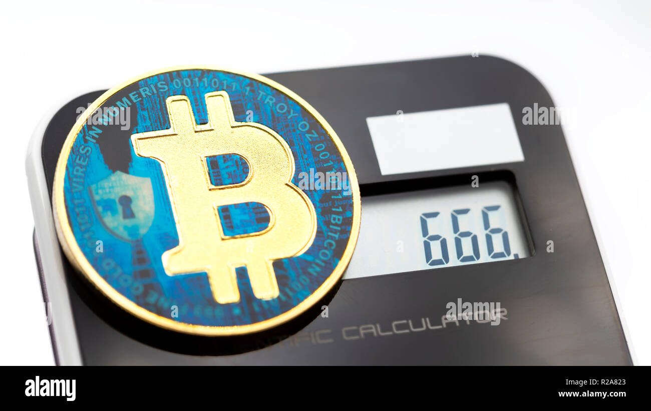 near a calculator the coin of bitcoin like concept of future and investment  666 in the display Stock Photo - Alamy