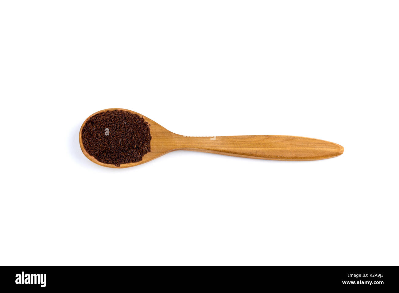 top view of a spoon of sandal wood with ground coffee beans   isolated on white background Stock Photo