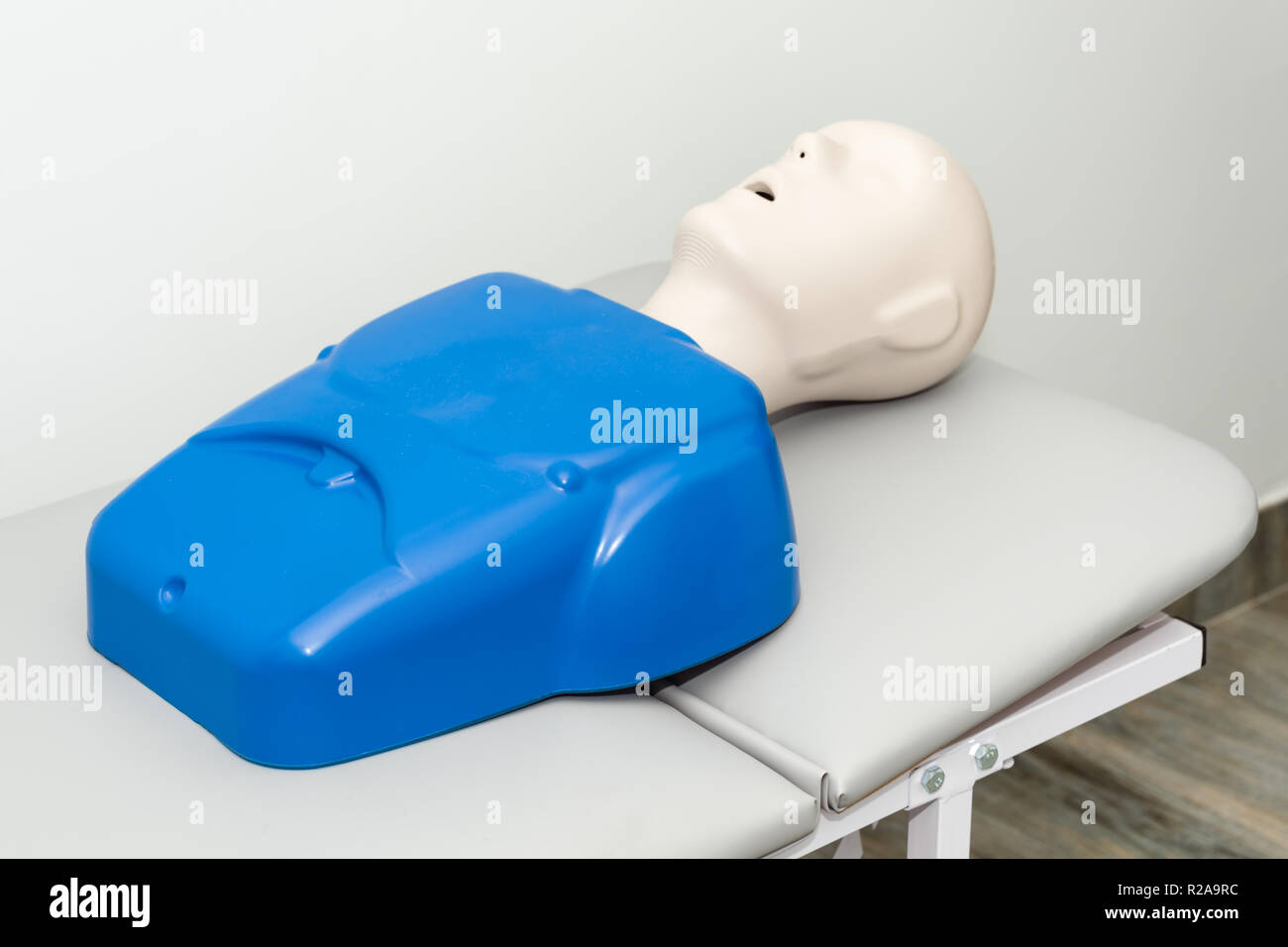 Hospital training dummy on hospital bed with mouth open. Horizontal image with copy space. Medical first aid learning training mannequin Stock Photo