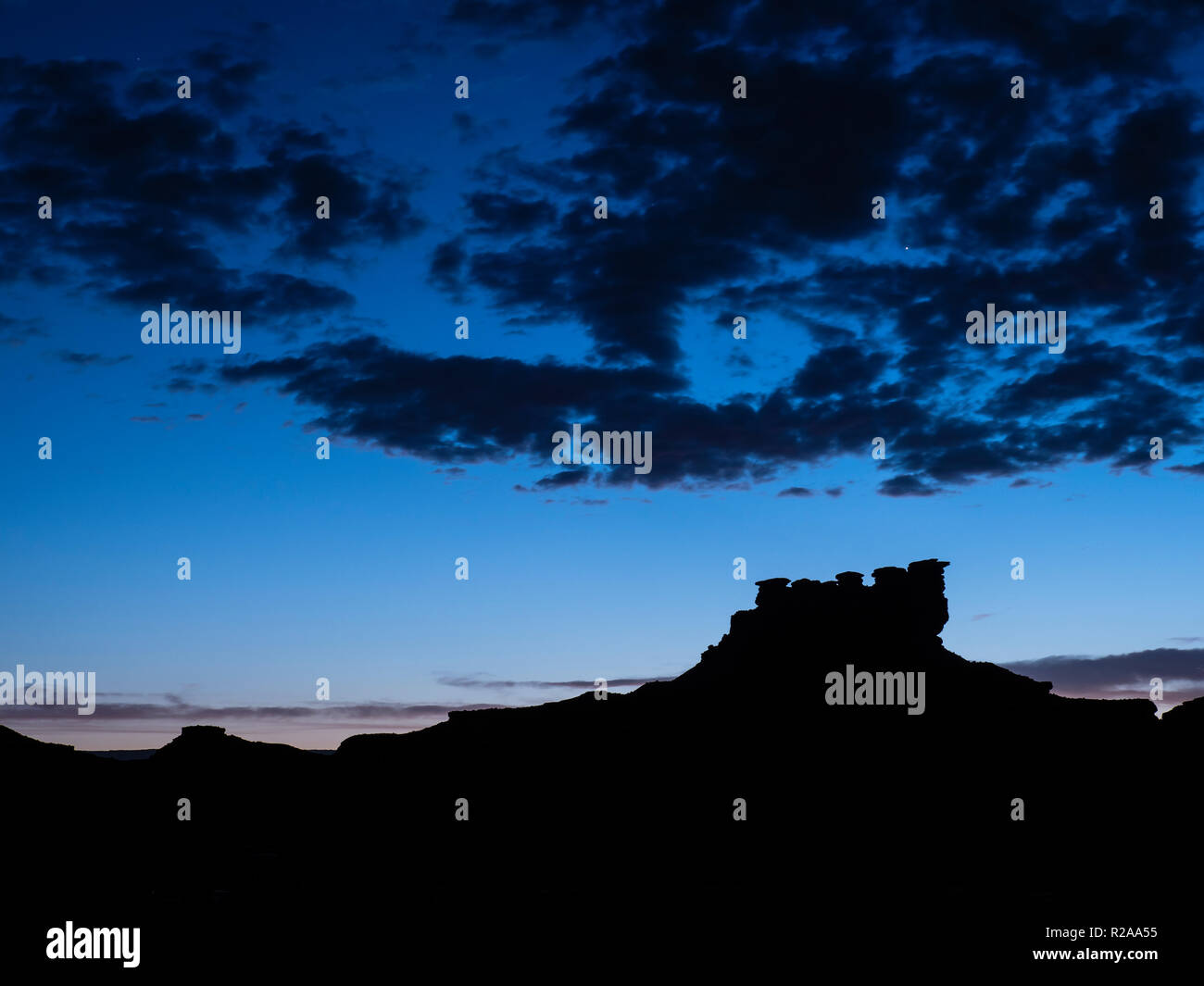 Seven Sailors formation at dusk, Valley of the Gods west of Bluff, Utah. Stock Photo