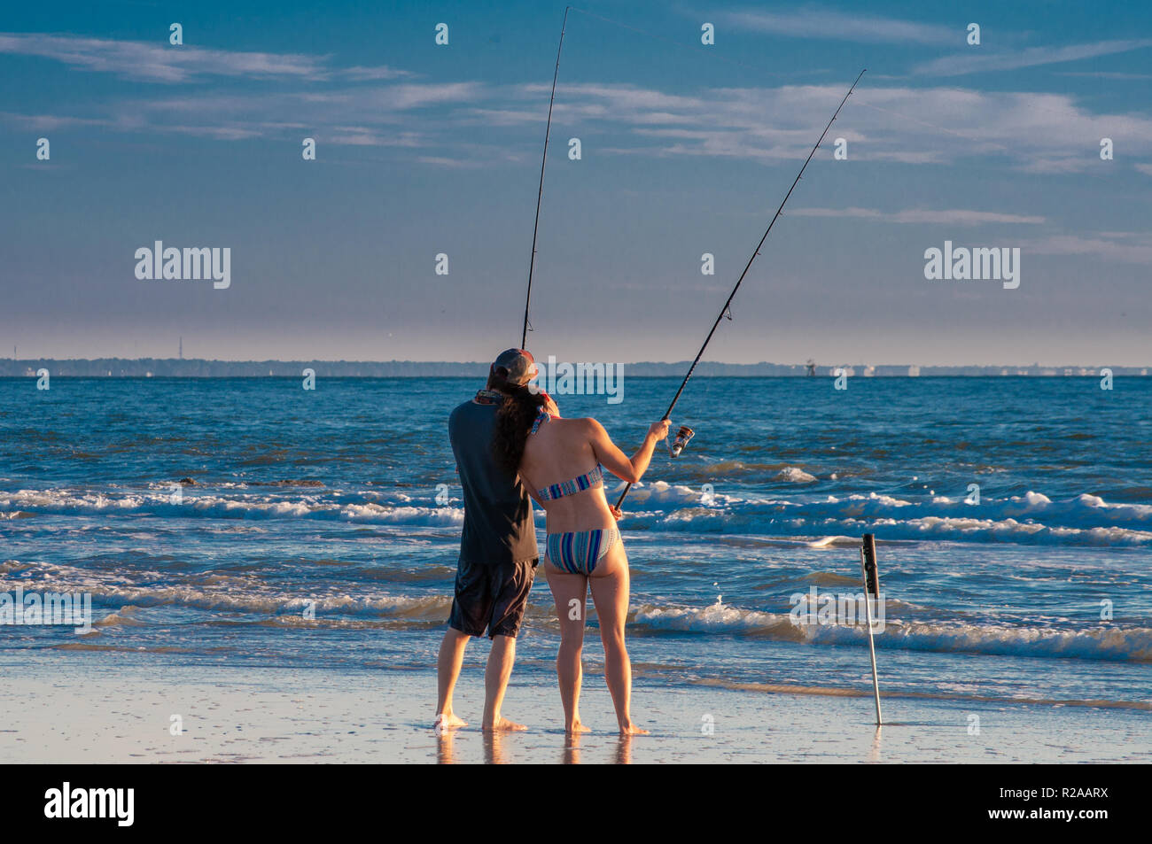 Young couple in love fishing together Stock Photo