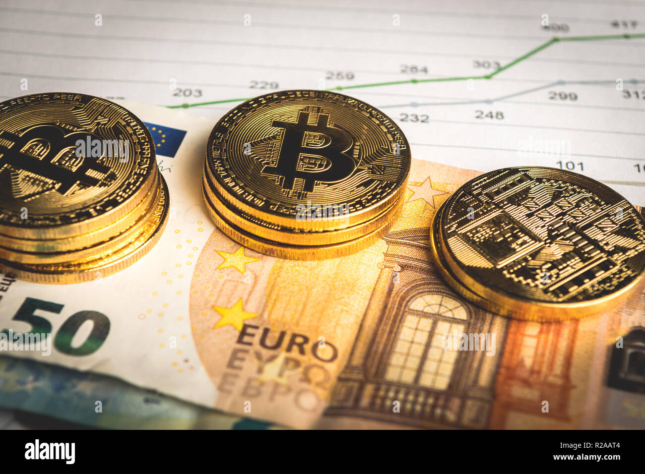 Golden coins of crypto currency Bitcoin and Euro paper money Stock Photo -  Alamy