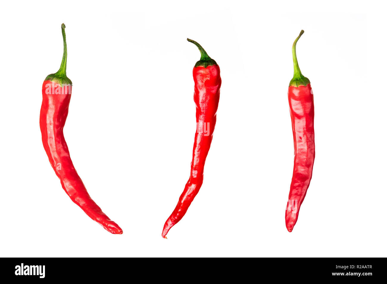 three pieces of red chili peppers isolated on white background Stock Photo
