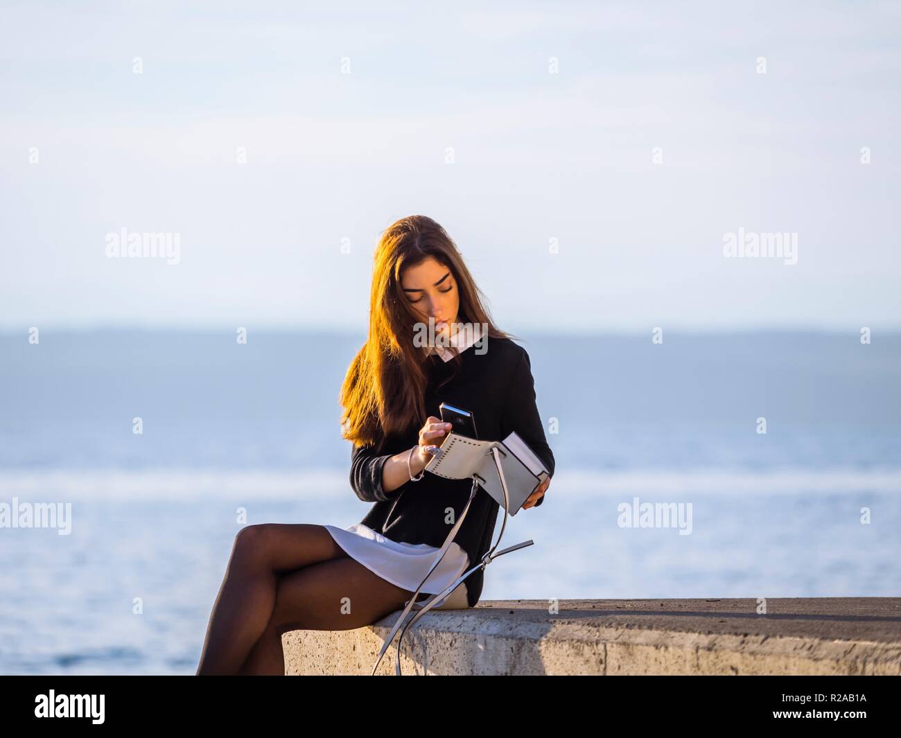 Teenage teen girl crossed legs cross legged Stock Photo Alamy