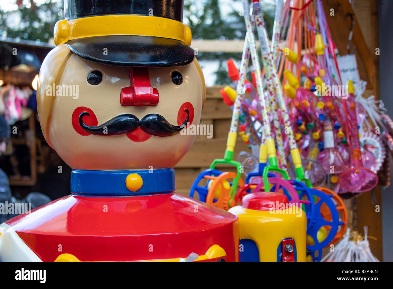 Nutcracker statue next to candy on Christmas Market Stock Photo