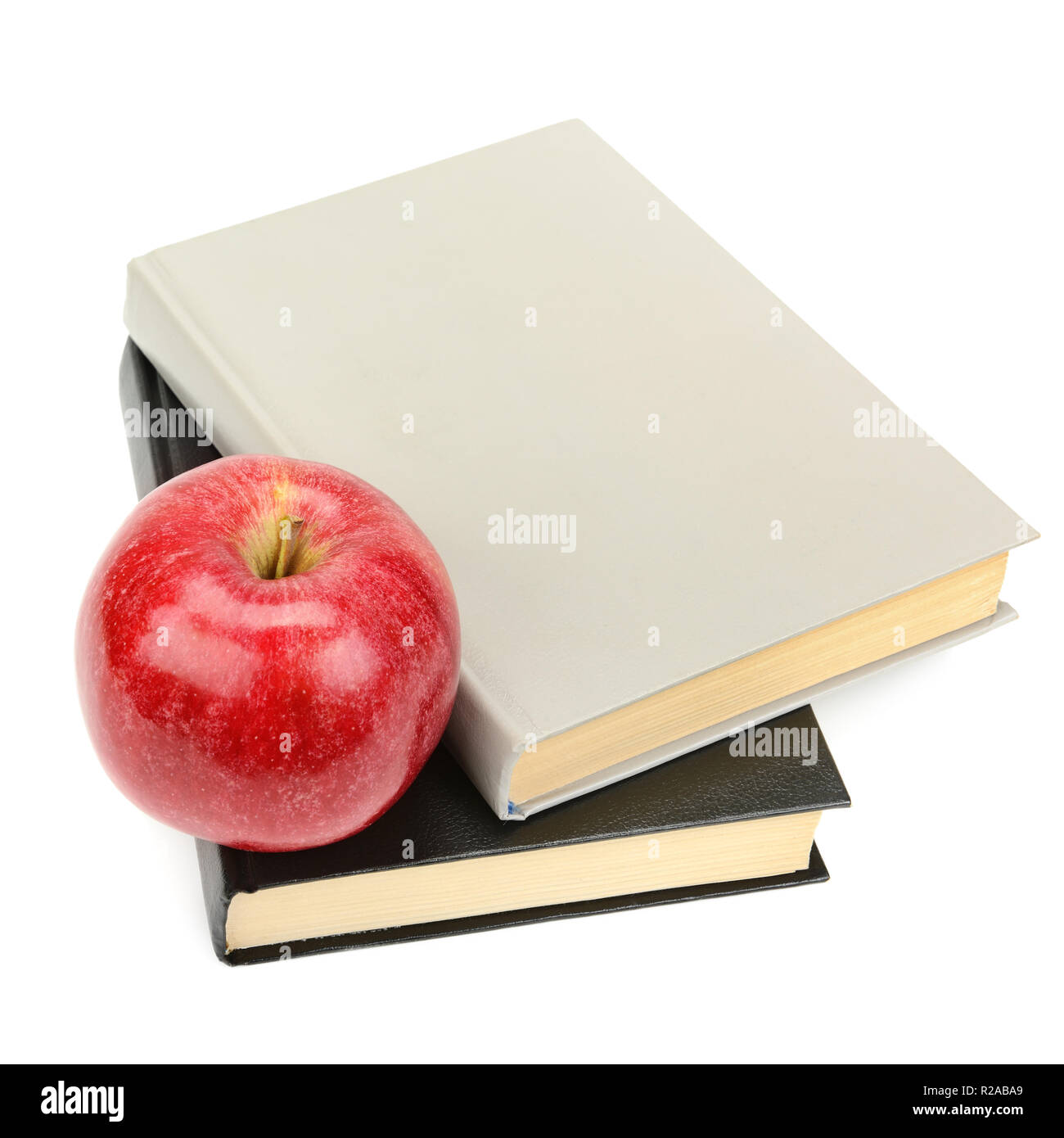 books and apple isolated on white background Stock Photo - Alamy