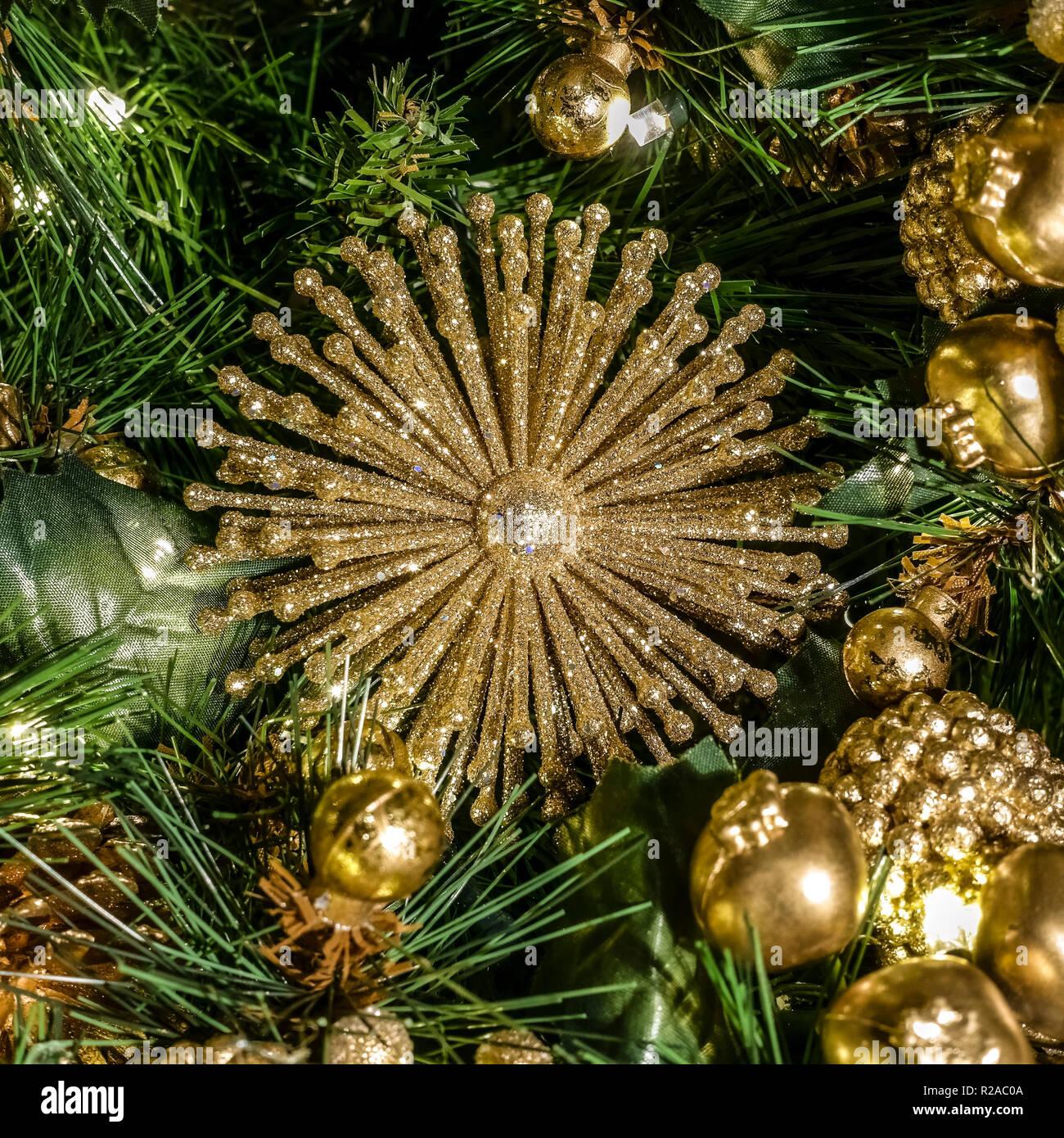 Golden christmas tree decorations. Christmas time festive mood atmosphere. Seasonal image. Stock Photo