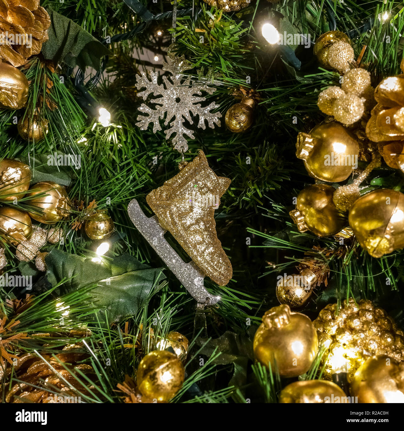 Golden Christmas tree decoration. Christmas time festive mood atmosphere. Seasonal image. Stock Photo